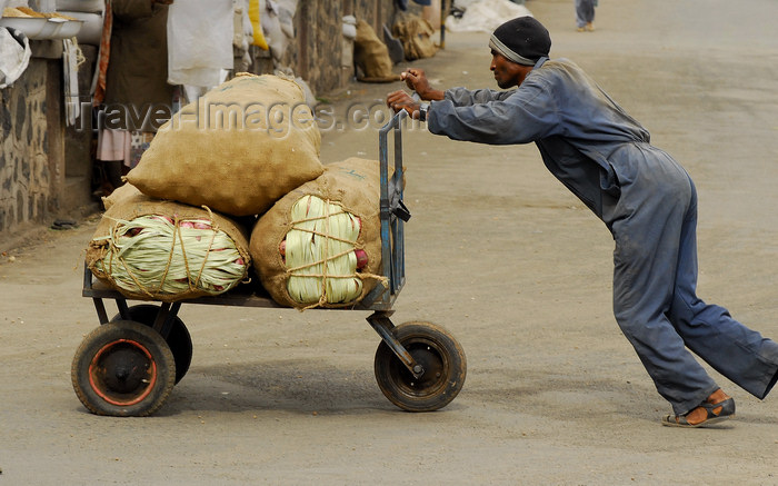 eritrea1: Eritrea - Asmara: a man pushing a heavily loaded hand cart - market area - photo by E.Petitalot - (c) Travel-Images.com - Stock Photography agency - Image Bank