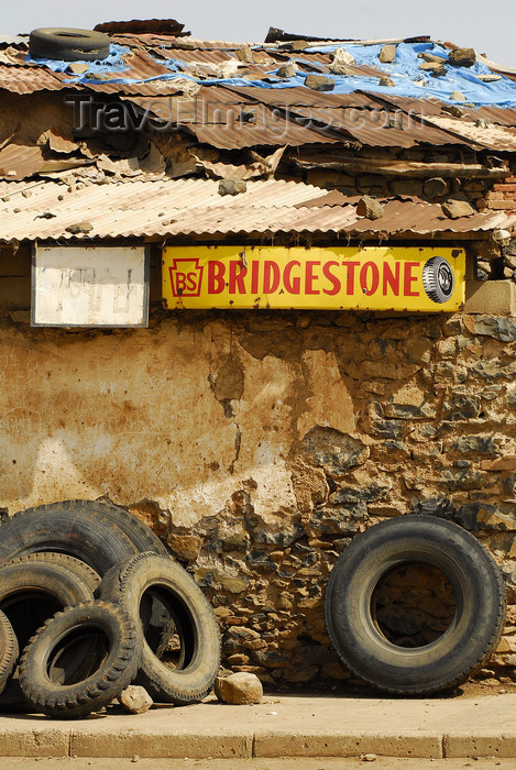 eritrea85: Eritrea - Mendefera, Southern region: an old tyre shop - Bridgestone sign - photo by E.Petitalot - (c) Travel-Images.com - Stock Photography agency - Image Bank