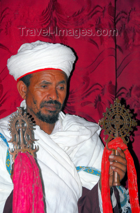 ethiopia187: Lalibela, Amhara region, Ethiopia: Bet Giyorgis rock-hewn church - priest with crosses - UNESCO world heritage site - photo by M.Torres - (c) Travel-Images.com - Stock Photography agency - Image Bank