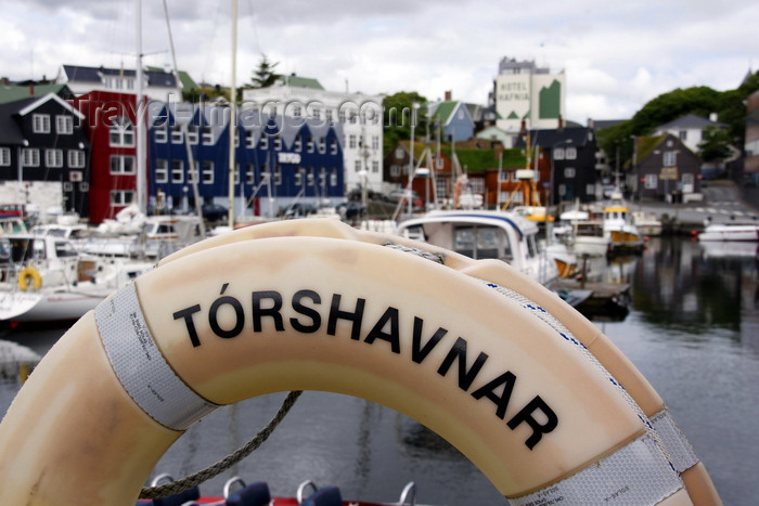 faeroe120: Tórshavn, Streymoy island, Faroes: lifebuoy  in the and the east harbour, Eystaravág - Tórshavnar - Tinganes in the background - photo by A.Ferrari - (c) Travel-Images.com - Stock Photography agency - Image Bank