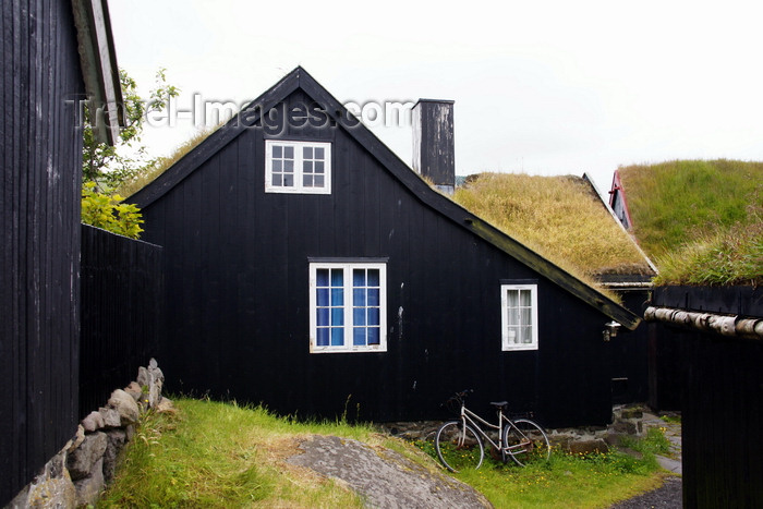 faeroe128: Tórshavn, Streymoy island, Faroes: bike and Faroese sod roofed houses of Tinganes - photo by A.Ferrari - (c) Travel-Images.com - Stock Photography agency - Image Bank