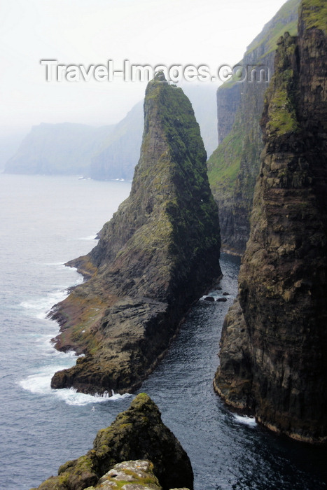 faeroe67: Vágar island, Faroes: Geituskorardrangur - a towering basalt stack standing 116m above the ocean, by the vertical cliff face - photo by A.Ferrari - (c) Travel-Images.com - Stock Photography agency - Image Bank