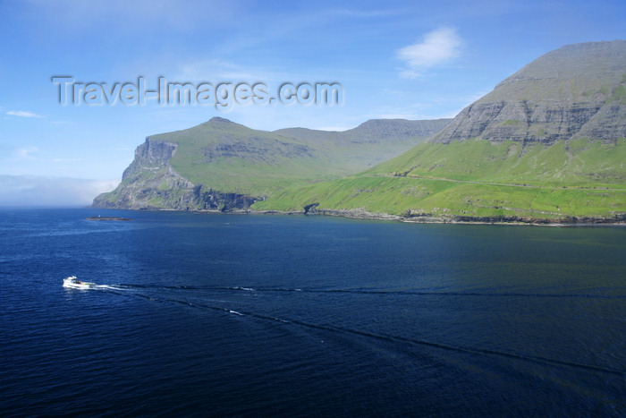 faeroe78: Sørvágsfjørður fjord, Vágar island, Faroes: a fishing boat leaves for the ocean - bow waves - photo by A.Ferrari - (c) Travel-Images.com - Stock Photography agency - Image Bank