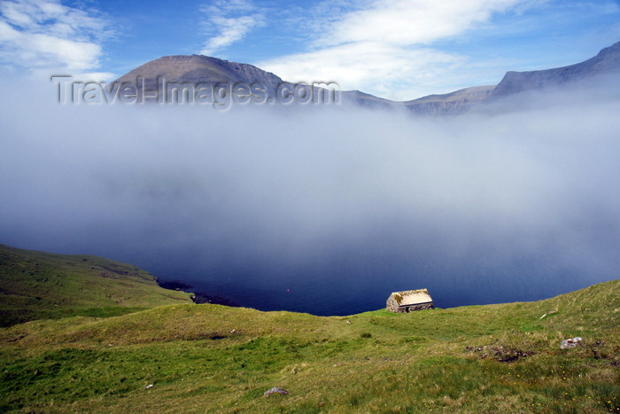 faeroe80: Sørvágsfjørður fjord, Vágar island, Faroes: fog and cottage on the cliff edge - photo by A.Ferrari - (c) Travel-Images.com - Stock Photography agency - Image Bank