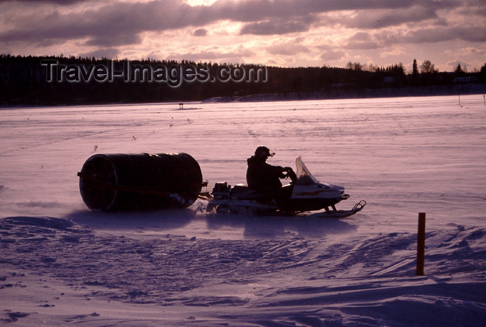 fin115: Finland - Lapland - Rovaniemi - preapring the golfcourse - cilinder and moto-ski -  Arctic Golf - Arctic images by F.Rigaud - (c) Travel-Images.com - Stock Photography agency - Image Bank