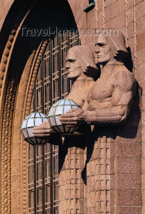 fin183: Helsinki, Finland: train station - statues holding spherical lamps - Helsingin rautatieasema - photo by A.Bartel - (c) Travel-Images.com - Stock Photography agency - Image Bank