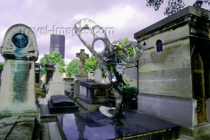 france1002: Paris, France: tombs at the Montparnasse Cemetery with Montparnasse tower in the background - 14e arrondissement - photo by K.Gapys - (c) Travel-Images.com - Stock Photography agency - Image Bank