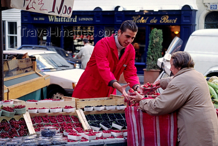 france1049: Paris, France: buying berries at a street market - Saint Germain des Près, Rue de Buci - 6e arrondissement - photo by C.Lovell - (c) Travel-Images.com - Stock Photography agency - Image Bank