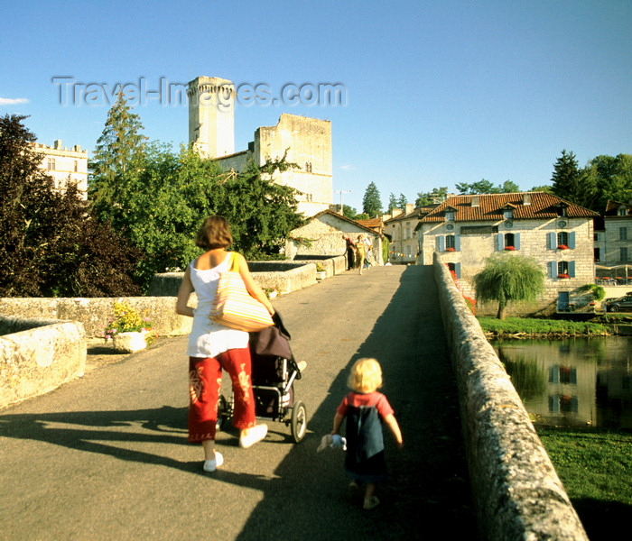 france1204: Bourdeilles, Dordogne, Aquitaine, France: toddler and woman with stroller cross the bridge towards Château de Bourdeilles - photo by K.Gapys - (c) Travel-Images.com - Stock Photography agency - Image Bank