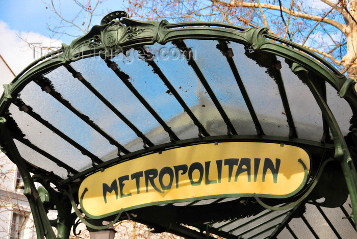 france570: Paris, France: art nouveau entrace to metro station Abbesses, Line 12, cast iron structure with a fan-shaped glass awning, known as édicule, designed by Hector Guimard - 'Metropolitain' sign, iconic symbol of Paris - Bouche de métro Guimard - Place des Abbesses, Montmartre district, 18e arrondissement - photo by M.Torres - (c) Travel-Images.com - Stock Photography agency - Image Bank