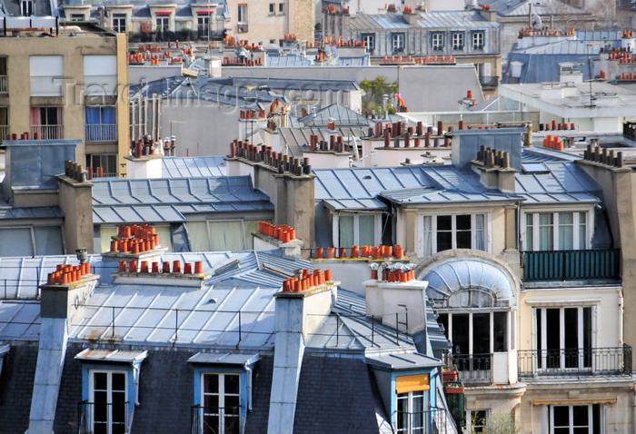 france574: Paris, France: mansard roofs and chimneys with red pipes of Montmartre district, 18e arrondissement - photo by M.Torres - (c) Travel-Images.com - Stock Photography agency - Image Bank