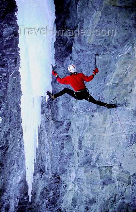 france916: La Grave, Briançon, Hautes-Alpes, PACA, France: iceclimber on free hanging icefall by a verticall rock wall - mountaineering - photo by S.Egeberg - (c) Travel-Images.com - Stock Photography agency - Image Bank