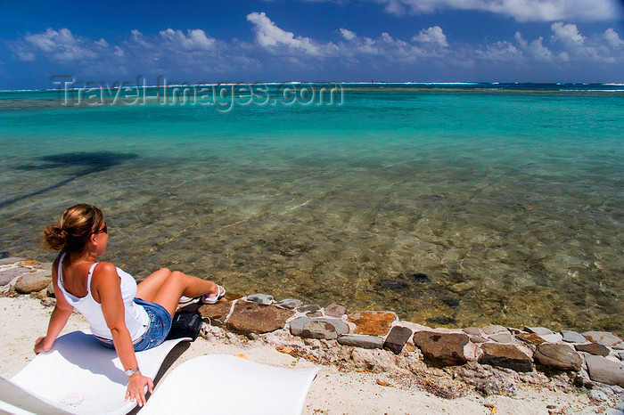 french-polynesia128: Papetoai, Moorea, French Polynesia: young woman by the lagoon - photo by D.Smith - (c) Travel-Images.com - Stock Photography agency - Image Bank