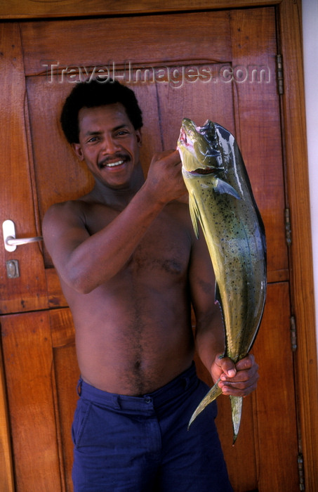 galapagos21: Galapagos Islands, Ecuador: crewman of the Samba with a fresh catch of Mahi Mahi (Dolphin Fish) - photo by C.Lovell - (c) Travel-Images.com - Stock Photography agency - Image Bank
