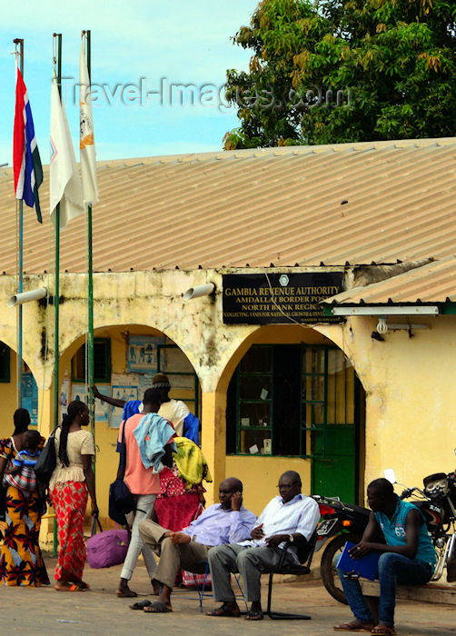 gambia118: Amdallai, North Bank division, Gambia: people sit and wait at the Amdallai / Karang border crossing between The Gambia and Senegal - Gambia Revenue Authority - photo by M.Torres - (c) Travel-Images.com - Stock Photography agency - Image Bank