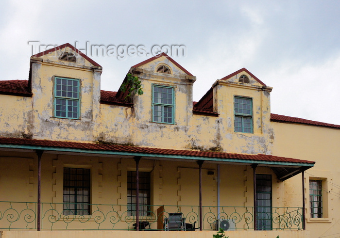 gambia2: Banjul, The Gambia: British colonial architecture of the old Bathurst - ornate wrought iron balcony on a colonial building with mansard roof - Ecowas avenue - photo by M.Torres - (c) Travel-Images.com - Stock Photography agency - Image Bank