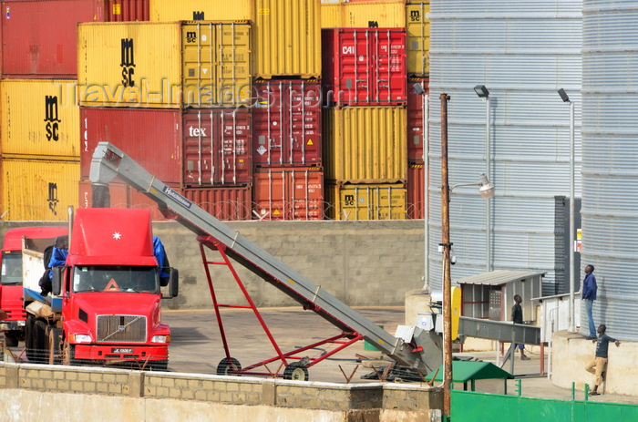 gambia20: Banjul, The Gambia: port of Banjul - grain is loaded into trucks from the port's silos - grain elevator with containers in the background - photo by M.Torres - (c) Travel-Images.com - Stock Photography agency - Image Bank