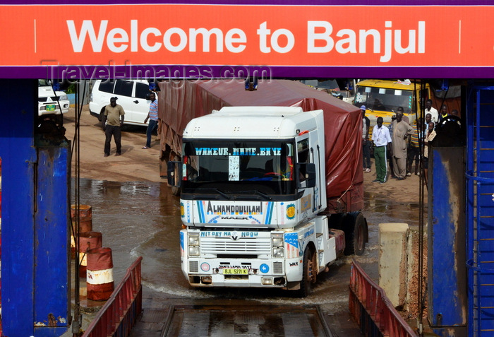 gambia23: Banjul, The Gambia: a trucks struggles to board the ferry to Barra, across de river Gambia - photo by M.Torres - (c) Travel-Images.com - Stock Photography agency - Image Bank