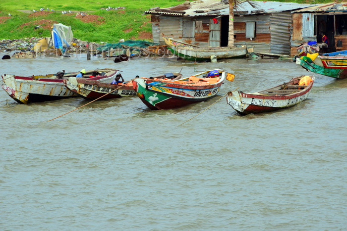 gambia27: Banjul, The Gambia: traditional wooden fishing boats and fishermen huts made of corrugated metal - photo by M.Torres - (c) Travel-Images.com - Stock Photography agency - Image Bank