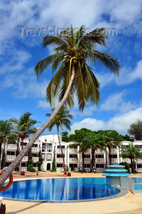 gambia63: Banjul, The Gambia: pool side view of the Laico Atlantic hotel, with a coconut tree leaning over the pool - photo by M.Torres - (c) Travel-Images.com - Stock Photography agency - Image Bank