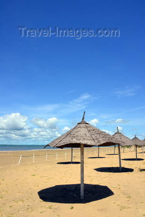 gambia64: Banjul island, The Gambia: beach with golden sand beach on the north shore of Banjul Island, near the Laico Atlantic hotel - beach umbrellas and deep blue sky - photo by M.Torres - (c) Travel-Images.com - Stock Photography agency - Image Bank