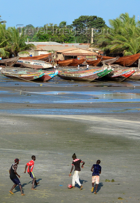 gambia73: Barra, The Gambia: beach soccer against a background of wooden fishing boats - photo by M.Torres - (c) Travel-Images.com - Stock Photography agency - Image Bank