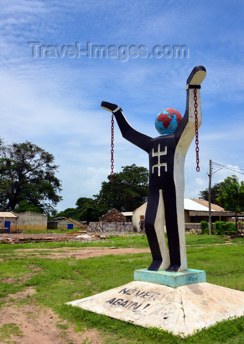 gambia89: Albreda, Gambia: Emancipation Statue, slavery sculpture with 'never again' at the base - broken chains, globe head and oddly the Berber symbol on the chest - photo by M.Torres  - (c) Travel-Images.com - Stock Photography agency - Image Bank