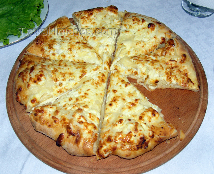 georgia163: Tbilisi, Georgia: khachapuri - flatbread filled with contrasting cheeses - traditional Georgian dish - Caucasian Foccacia - photo by N.Mahmudova - (c) Travel-Images.com - Stock Photography agency - Image Bank