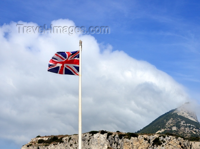gibraltar25: Gibraltar: Union Jack in the wind and southern view of the Rock, Europa Point - orographic clouds - hoto by M.Torres - (c) Travel-Images.com - Stock Photography agency - Image Bank