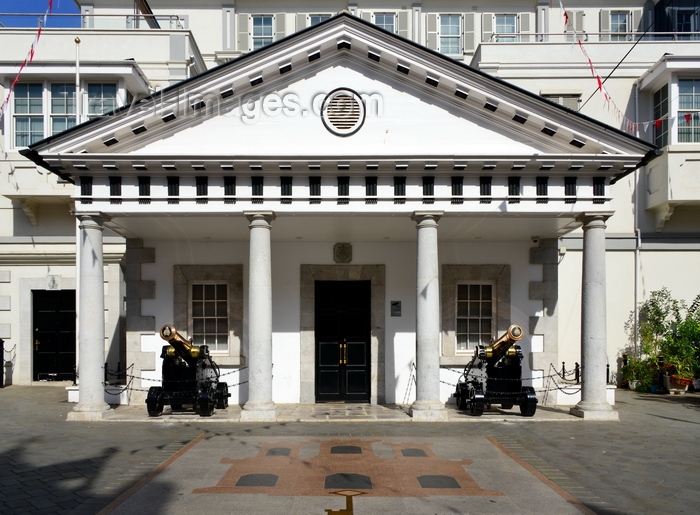 gibraltar76: Gibraltar: portico with cannons and coat of arms in the pavement - Guard House of the residence of the Governor of Gibraltar, the Convent - Convent Place, Main Street - photo by M.Torres - (c) Travel-Images.com - Stock Photography agency - Image Bank