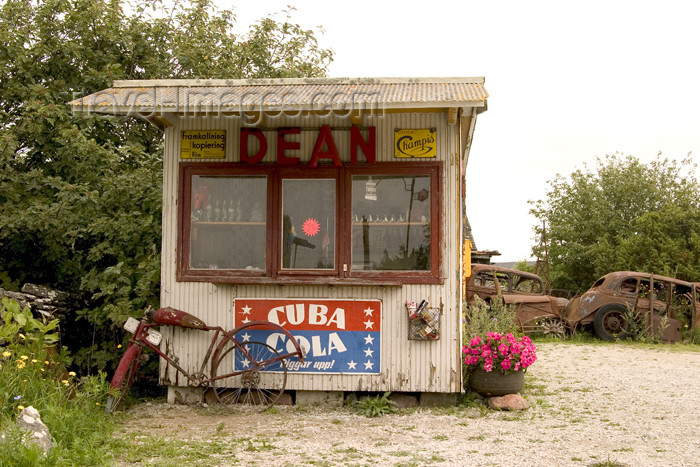 gotland8: Sweden - Gotland / Gotlands län - Fårö island: Dean's kiosk cum scrap yard - Cuba Cola - rusting cars and bike - photo by C.Schmidt - (c) Travel-Images.com - Stock Photography agency - Image Bank