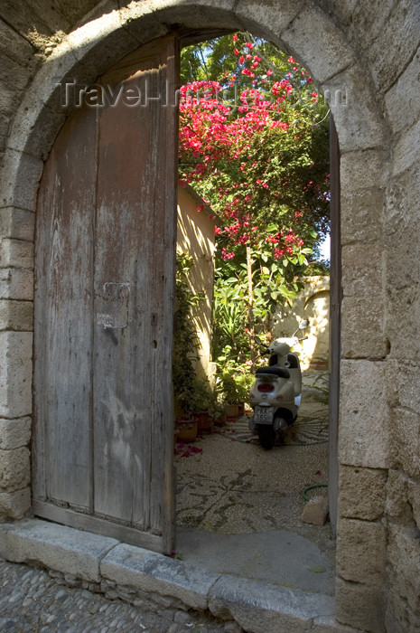 greece347: Greece, Dodecanese Islands, Rhodes: scooter in doorway of old house in Old Town - (c) Travel-Images.com - Stock Photography agency - Image Bank