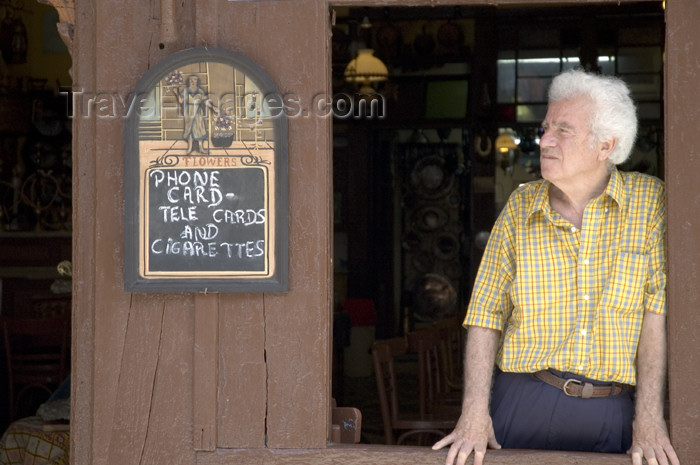 greece355: Greece, Dodecanese Islands, Rhodes: man looking out of old style coffee shop in Old Town - (c) Travel-Images.com - Stock Photography agency - Image Bank