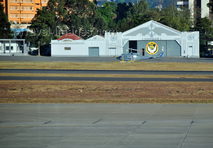 guatemala115: Ciudad de Guatemala / Guatemala city: airport - Bell 212 Twin Huey helicopter and old style hangar - Guatemalan Air Force - Fuerza Aérea Guatemalteca, FAG - photo by M.Torres - (c) Travel-Images.com - Stock Photography agency - Image Bank