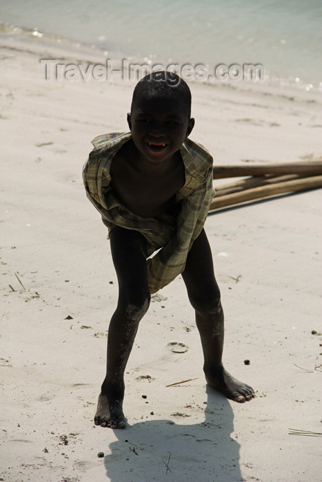 guinea-bissau136: Rubane Island, Bijagós Archipelago - UNESCO biosphere reserve, Bubaque sector, Bolama region, Guinea Bissau / Guiné Bissau: playful boy on the beach / rapaz divertido na praia - photo by R.V.Lopes - (c) Travel-Images.com - Stock Photography agency - Image Bank