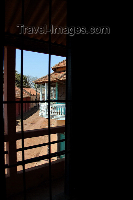 guinea-bissau200: Guinea Bissau / Guiné Bissau - Bafatá, Bafatá Region: view of the old colonial commercial street though window grill / vista da antiga rua comercial do período colonial português - photo by R.V.Lopes - (c) Travel-Images.com - Stock Photography agency - Image Bank