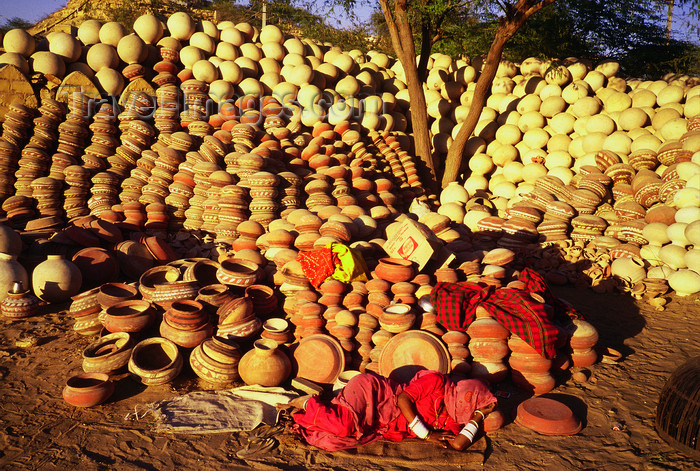 india115: India - Rajasthan: woman sleeping in a front of a stock of pottery - photo by E.Petitalot - (c) Travel-Images.com - Stock Photography agency - Image Bank