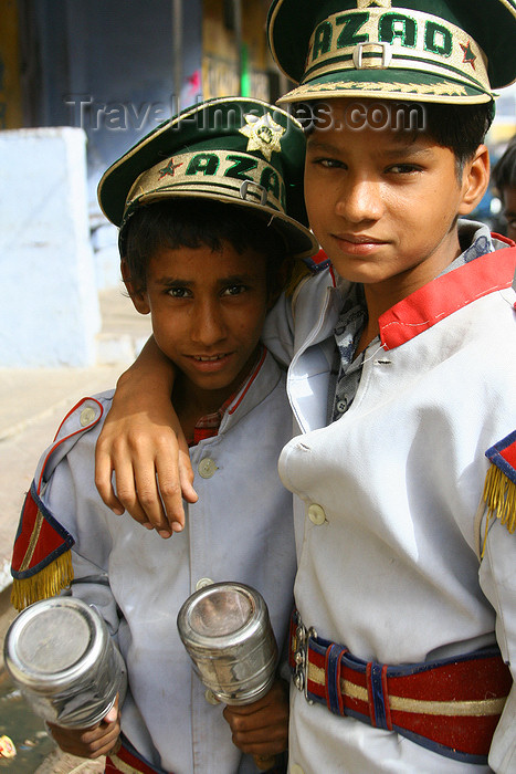 india118: Bundi, Rajasthan, India: boys with maracas and 'Azad' hats - photo by M.Wright - (c) Travel-Images.com - Stock Photography agency - Image Bank