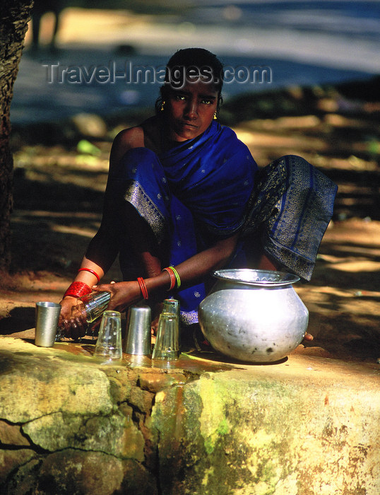 india361: Orissa, India: a girl sells cow milk at a road crossing - photo by E.Petitalot - (c) Travel-Images.com - Stock Photography agency - Image Bank