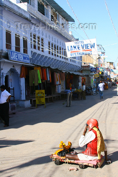 india453: Pushkar, Rajasthan, India: beggar and Lake View hotel - photo by M.Wright - (c) Travel-Images.com - Stock Photography agency - Image Bank