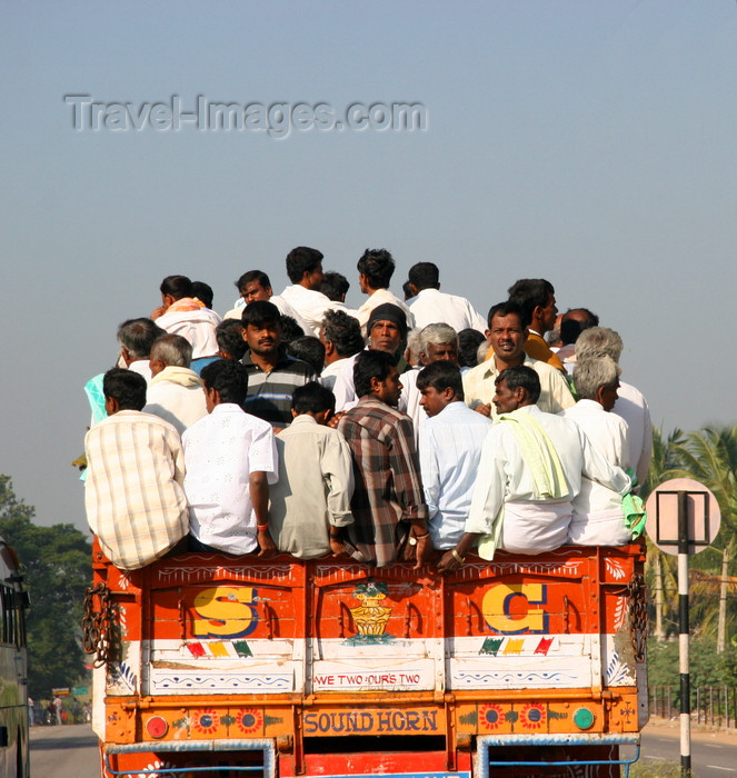 india469: Karnataka, India: India Mass transit - passengers densely packed on the back of a truck - photo by J.Cave - (c) Travel-Images.com - Stock Photography agency - Image Bank