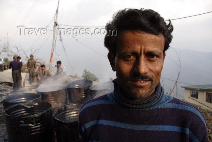 india480: Darjeeling, West Bengal, India: roadworker and tar drums - photo by G.Koelman - (c) Travel-Images.com - Stock Photography agency - Image Bank