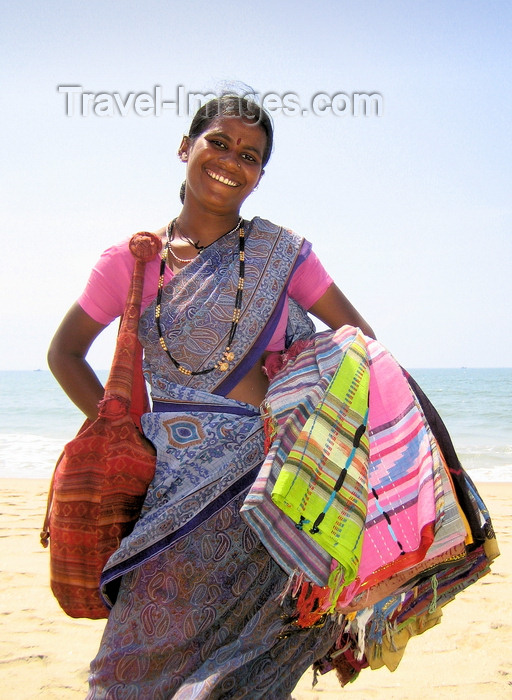 india76: Goa, India: Arambol Beach - the ever smiling, ever insistent, beach textile seller - woman holding pareos - photo by R.Resende - (c) Travel-Images.com - Stock Photography agency - Image Bank