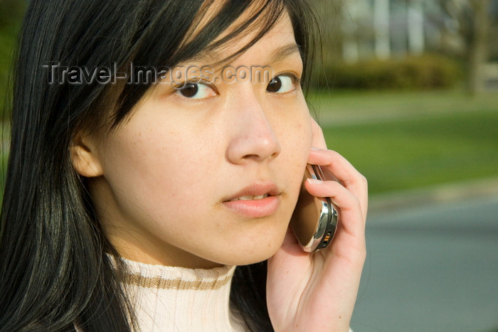 indonesia113: Bali, Indonesia: young Indonesian Asian woman talking on a cellular phone - Model Released - photo by D.Smith - (c) Travel-Images.com - Stock Photography agency - Image Bank