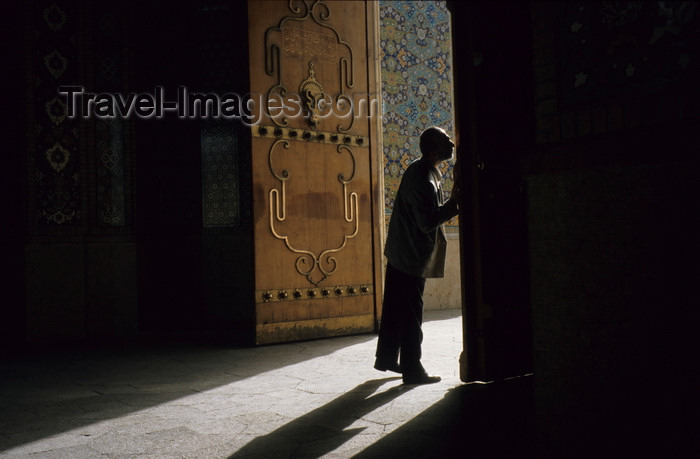 iran241: Iran - Shiraz: Shah-e-Cheragh mausoleum - man kissing the door - photo by W.Allgower - (c) Travel-Images.com - Stock Photography agency - Image Bank