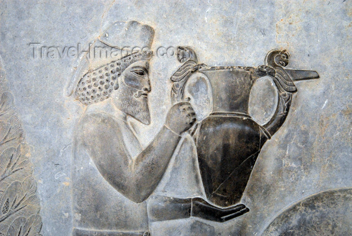 iran293: Iran - Persepolis:  Apadana - Eastern stairs - northern wall - relief showing tribute bearers - an Armenian man carries a present for the Darius the Great - a beautiful metal vessel with griffin (homa) handles - photo by M.Torres - (c) Travel-Images.com - Stock Photography agency - Image Bank