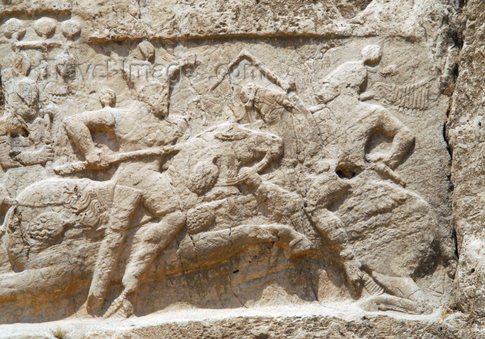 iran336: Iran - Naqsh-e Rustam: Equestrian relief of Bahram II, below tomb of Darius II Nothus - His enemy wears a Roman helmet and may be an emperor - photo by M.Torres - (c) Travel-Images.com - Stock Photography agency - Image Bank