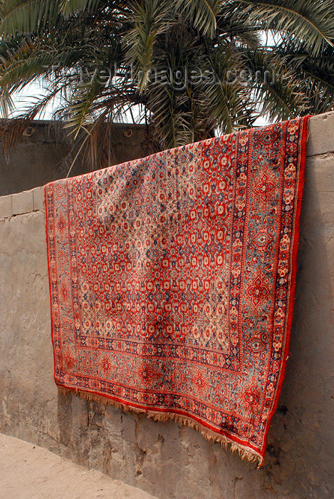 iran346: Iran - Hormuz island: Persian carpet on a wall - photo by M.Torres - (c) Travel-Images.com - Stock Photography agency - Image Bank