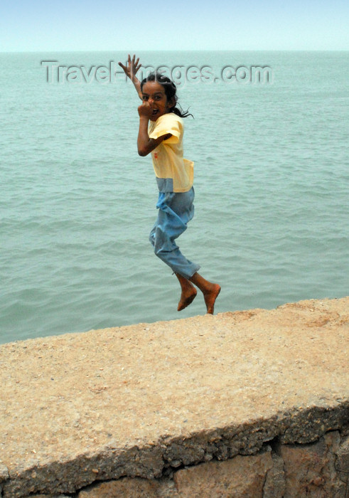 iran370: Iran - Hormuz island: a girl jumps into the Persian gulf - photo by M.Torres - (c) Travel-Images.com - Stock Photography agency - Image Bank