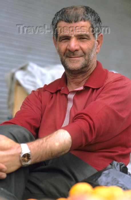 iran453: Iran: a fruit merchant sits by his stall - photo by W.Allgower - (c) Travel-Images.com - Stock Photography agency - Image Bank